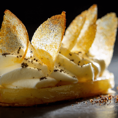 shukster_A_haute_cuisine_garnish_presented_on_matte_white_slate_cbf81eda-210f-41eb-a5ff-4e2aefb012a7