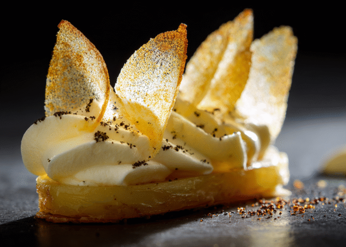 shukster_A_haute_cuisine_garnish_presented_on_matte_white_slate_cbf81eda-210f-41eb-a5ff-4e2aefb012a7